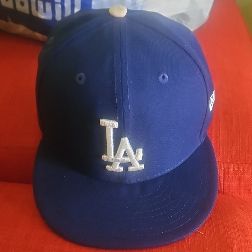 New Era Blue and Cream Hat with Iconic Design